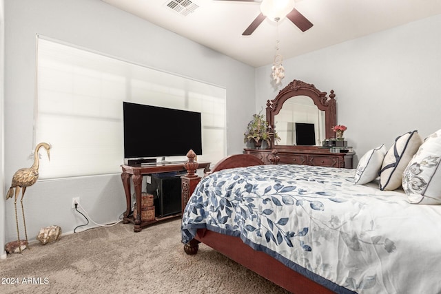 bedroom featuring ceiling fan and light carpet