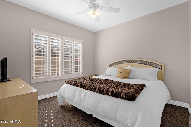 carpeted bedroom with baseboards and a ceiling fan