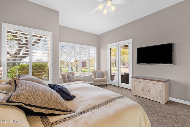 bedroom with light carpet, multiple windows, baseboards, and access to exterior