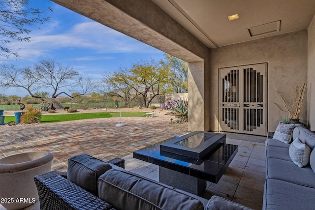 view of patio with fence and an outdoor living space