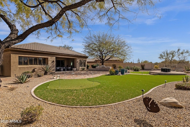 view of yard with a patio area and a fenced backyard