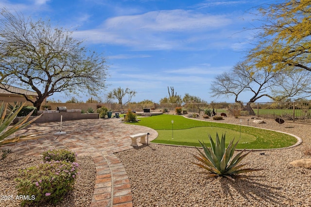 surrounding community featuring a fenced backyard and a patio