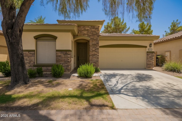 1851 W Periwinkle Way, Chandler, AZ 85248 - mediterranean / spanish-style house featuring stone siding, stucco siding, a garage, and driveway