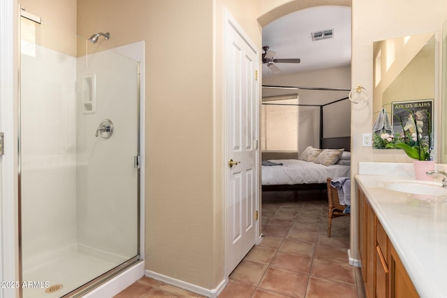 1851 W Periwinkle Way, Chandler, AZ 85248 - bathroom featuring ceiling fan, a shower stall, vanity, ensuite bath, and tile patterned flooring