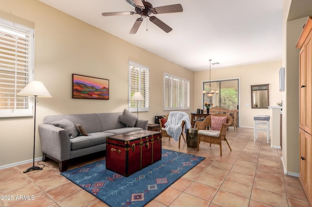 1851 W Periwinkle Way, Chandler, AZ 85248 - living area featuring a ceiling fan, light tile patterned floors, and a chandelier