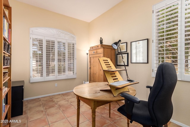 1851 W Periwinkle Way, Chandler, AZ 85248 - living area featuring a desk, vaulted ceiling, and tile patterned floors