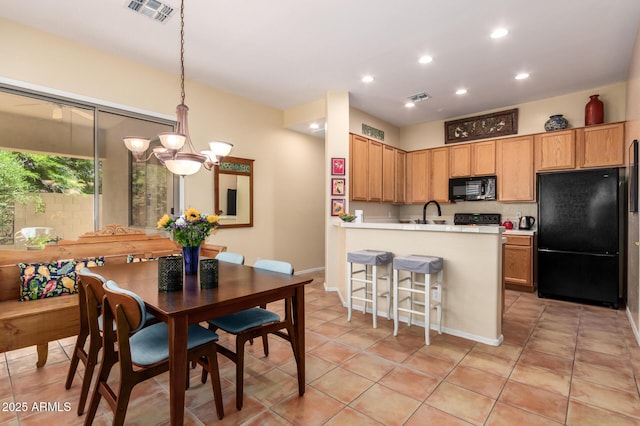 1851 W Periwinkle Way, Chandler, AZ 85248 - kitchen with black appliances, recessed lighting, light countertops, a peninsula, and hanging light fixtures