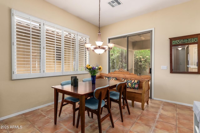 1851 W Periwinkle Way, Chandler, AZ 85248 - dining room with a chandelier and light tile patterned flooring