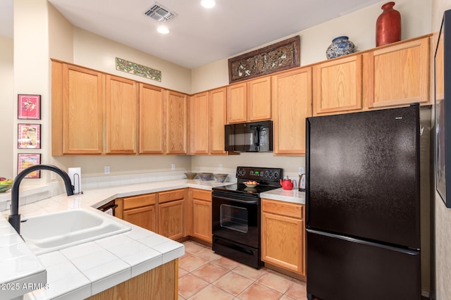 1851 W Periwinkle Way, Chandler, AZ 85248 - kitchen with black appliances, tile countertops, light tile patterned flooring, a peninsula, and recessed lighting
