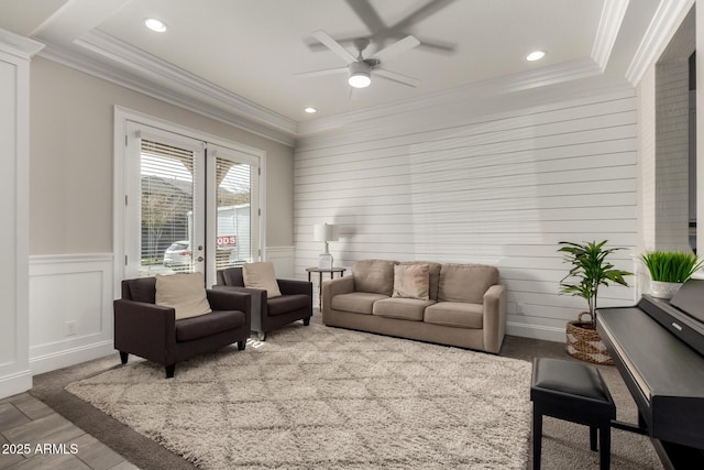 living room with ceiling fan and french doors