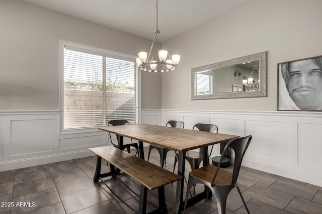 dining space featuring a notable chandelier