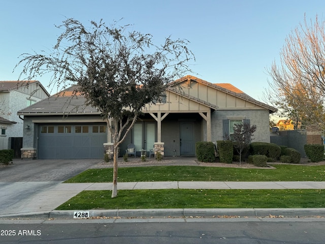 view of front facade with a garage and a front lawn