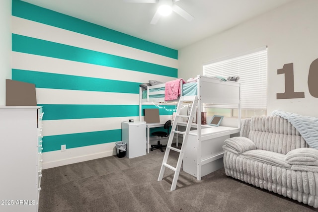 bedroom featuring ceiling fan and carpet