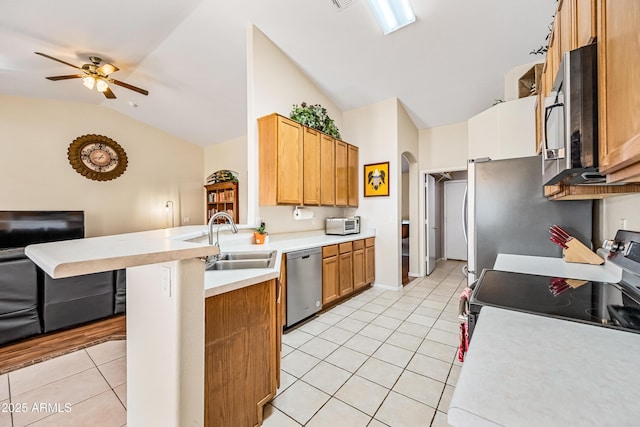 8479 E Sunrise Sky Dr, Gold Canyon, AZ 85118 - kitchen with light tile patterned flooring, a breakfast bar, sink, appliances with stainless steel finishes, and kitchen peninsula