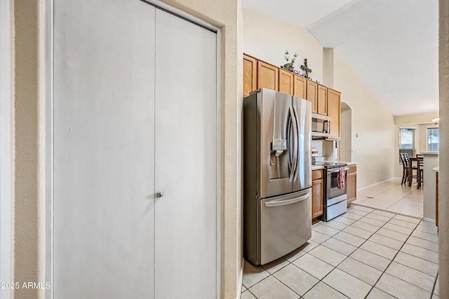 8479 E Sunrise Sky Dr, Gold Canyon, AZ 85118 - kitchen featuring appliances with stainless steel finishes, vaulted ceiling, and light tile patterned floors