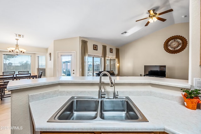 8479 E Sunrise Sky Dr, Gold Canyon, AZ 85118 - kitchen featuring sink, decorative light fixtures, vaulted ceiling, and ceiling fan with notable chandelier