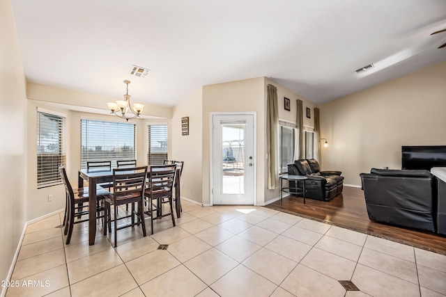 8479 E Sunrise Sky Dr, Gold Canyon, AZ 85118 - dining area featuring light tile patterned floors, a notable chandelier, and vaulted ceiling