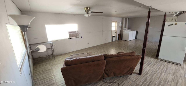 452 W Ray St, Superior, AZ 85173 - living area with independent washer and dryer, plenty of natural light, a ceiling fan, and cooling unit
