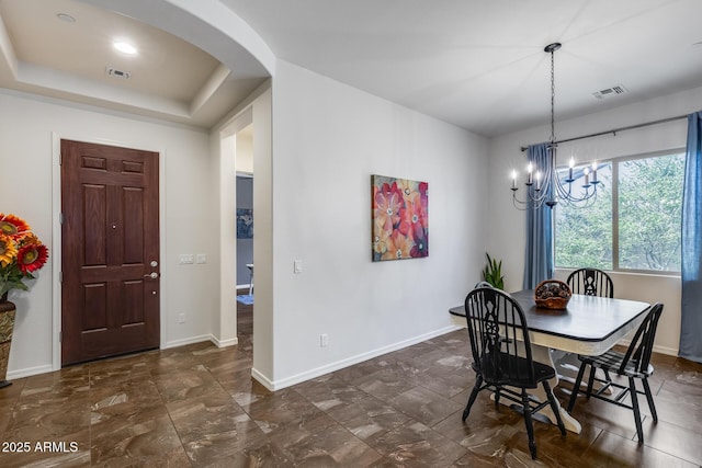 31332 N 137th Ln, Peoria, AZ 85383 - dining space with arched walkways, a chandelier, and a tray ceiling