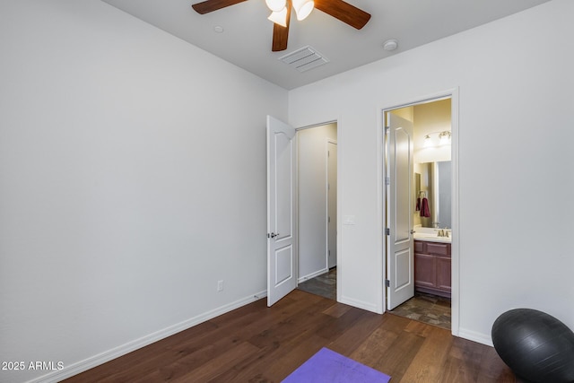 31332 N 137th Ln, Peoria, AZ 85383 - bedroom with dark wood-style flooring, ensuite bath, and a ceiling fan