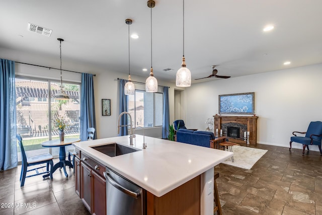 31332 N 137th Ln, Peoria, AZ 85383 - kitchen featuring stainless steel dishwasher, ceiling fan, light countertops, decorative light fixtures, and a stone fireplace