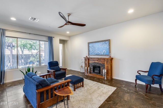 31332 N 137th Ln, Peoria, AZ 85383 - living area featuring a ceiling fan, a fireplace, recessed lighting, and dark stone finish floors