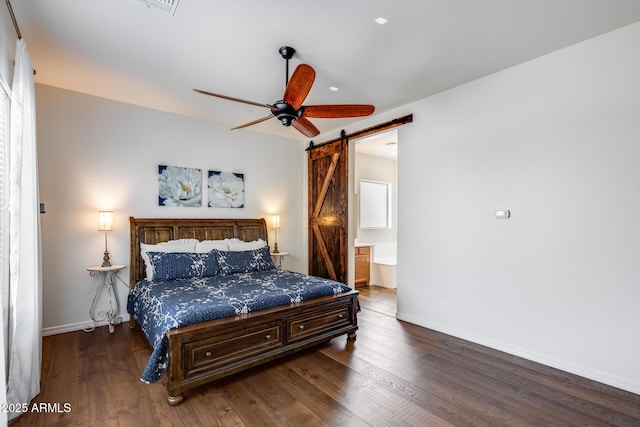31332 N 137th Ln, Peoria, AZ 85383 - bedroom featuring a barn door, wood finished floors, ensuite bathroom, and a ceiling fan