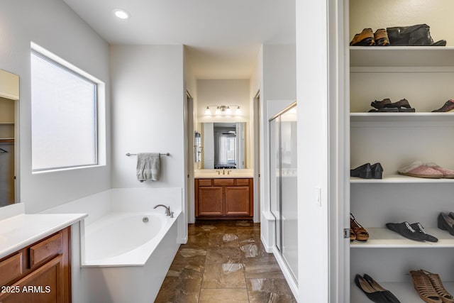 31332 N 137th Ln, Peoria, AZ 85383 - bathroom with vanity, a bath, a stall shower, and marble finish floors