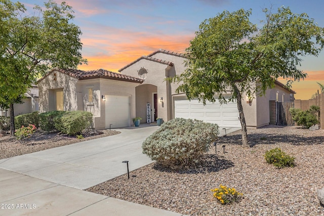 31332 N 137th Ln, Peoria, AZ 85383 - mediterranean / spanish-style house with a garage, stucco siding, a tiled roof, and driveway