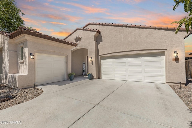 31332 N 137th Ln, Peoria, AZ 85383 - view of front of house with concrete driveway, a garage, and stucco siding