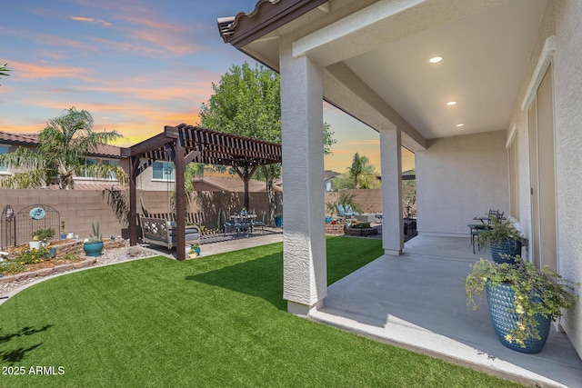 31332 N 137th Ln, Peoria, AZ 85383 - yard at dusk with a patio, a pergola, and a fenced backyard