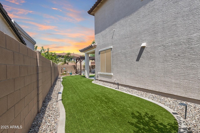 31332 N 137th Ln, Peoria, AZ 85383 - yard at dusk featuring a fenced backyard and a pergola
