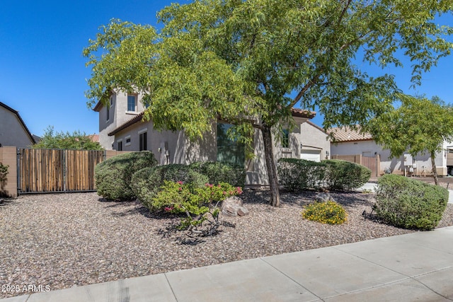 31332 N 137th Ln, Peoria, AZ 85383 - obstructed view of property featuring a gate, stucco siding, and a tile roof