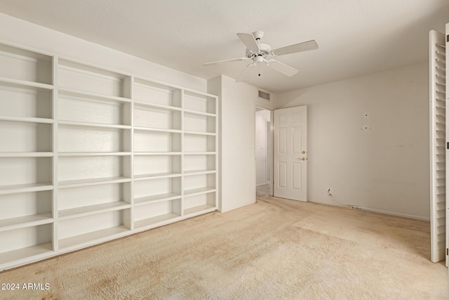 unfurnished bedroom featuring carpet flooring and ceiling fan