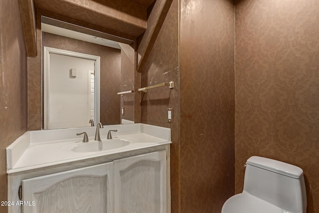 bathroom with vanity and toilet