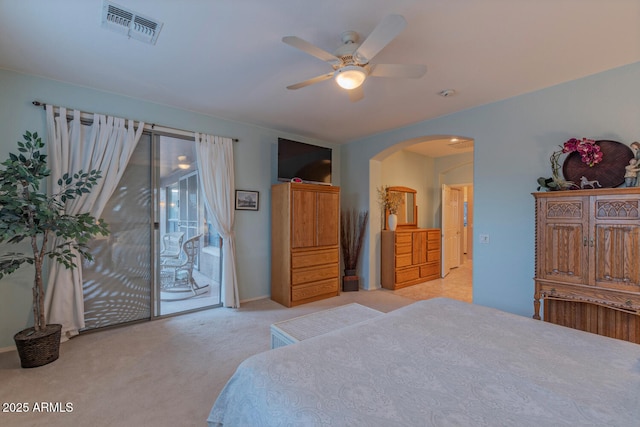 carpeted bedroom with ceiling fan and access to outside