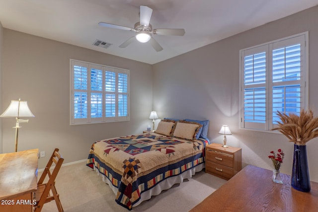 carpeted bedroom featuring ceiling fan