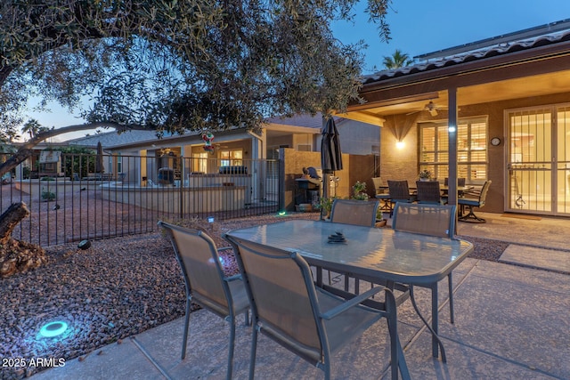 patio terrace at dusk with ceiling fan