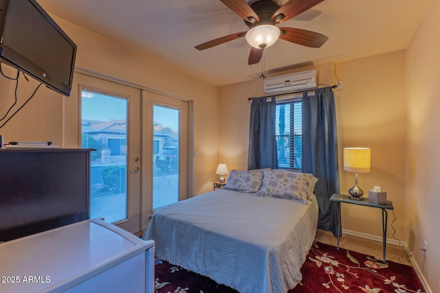 bedroom featuring ceiling fan, a wall unit AC, french doors, and access to outside