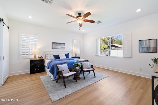 bedroom featuring recessed lighting, visible vents, baseboards, and light wood finished floors