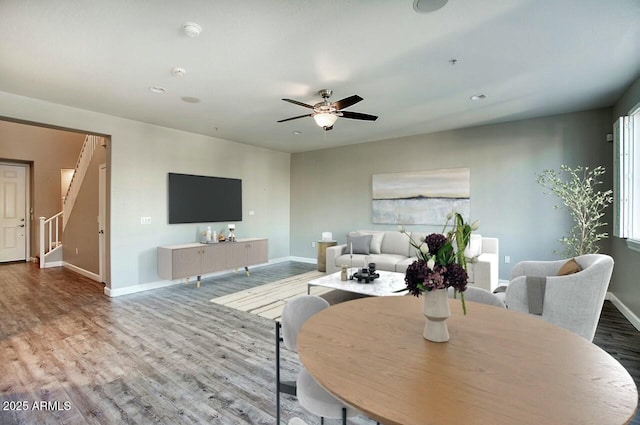 dining room featuring hardwood / wood-style floors, ceiling fan, and a healthy amount of sunlight