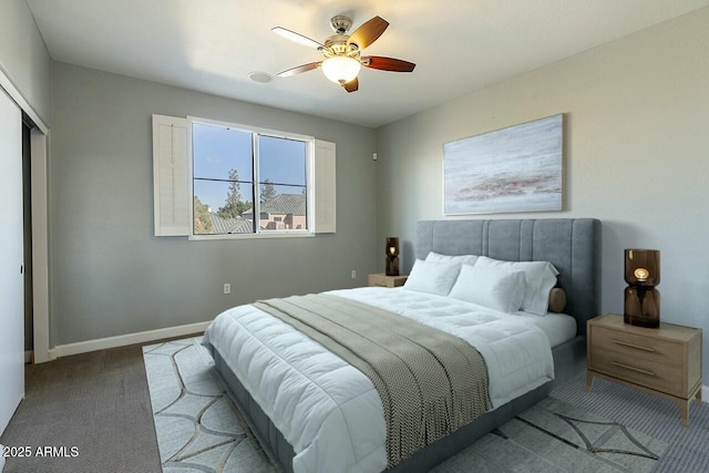 carpeted bedroom featuring ceiling fan and a closet