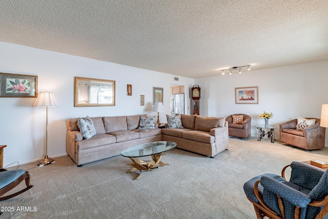 carpeted living room featuring a textured ceiling