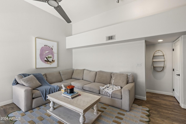 living room with ceiling fan, high vaulted ceiling, and dark wood-type flooring