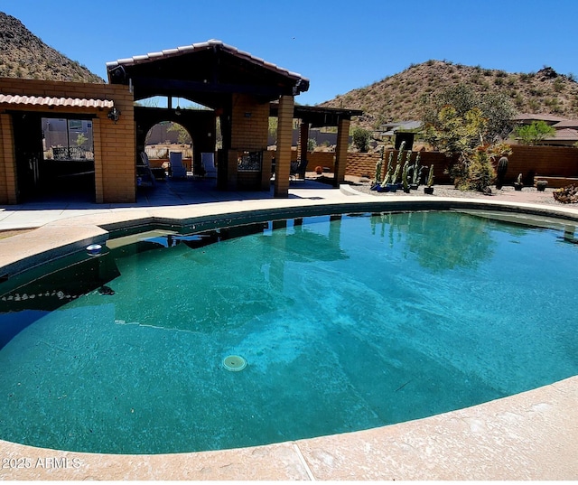 9607 E Mckellips Rd, Mesa, AZ 85207 - outdoor pool with a mountain view and a patio