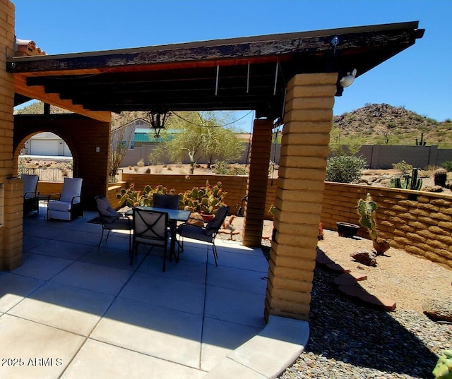 9607 E Mckellips Rd, Mesa, AZ 85207 - view of patio / terrace featuring outdoor dining space and a mountain view