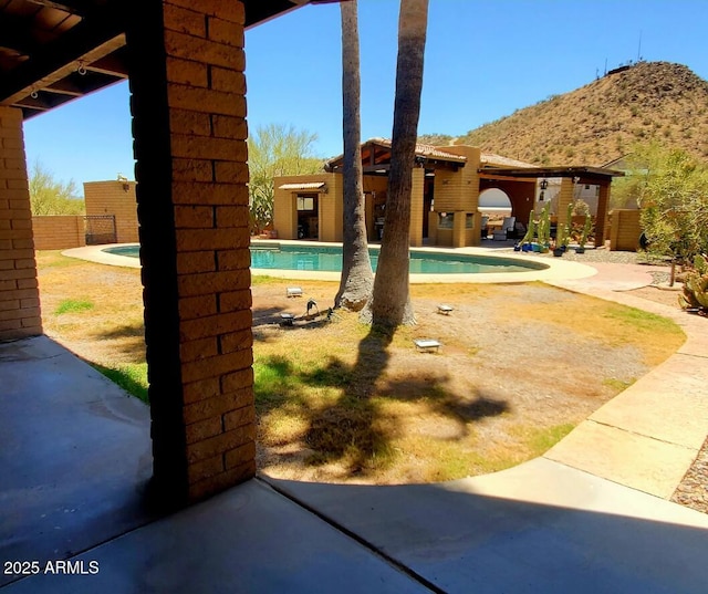 9607 E Mckellips Rd, Mesa, AZ 85207 - view of swimming pool with a patio area and a mountain view