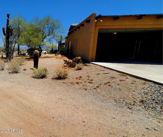 9607 E Mckellips Rd, Mesa, AZ 85207 - view of property exterior with brick siding and a garage