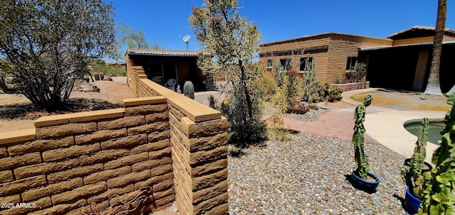 9607 E Mckellips Rd, Mesa, AZ 85207 - view of side of property featuring a patio area