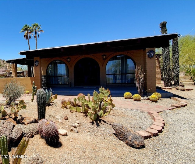 9607 E Mckellips Rd, Mesa, AZ 85207 - view of front facade with brick siding and covered porch